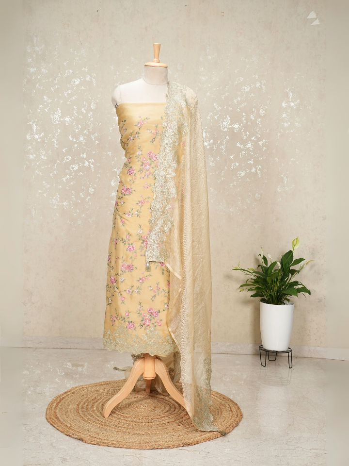Beige organza shirt with heavy thread embroidery and zari embroidery on hem and dupatta border with crepe bottom