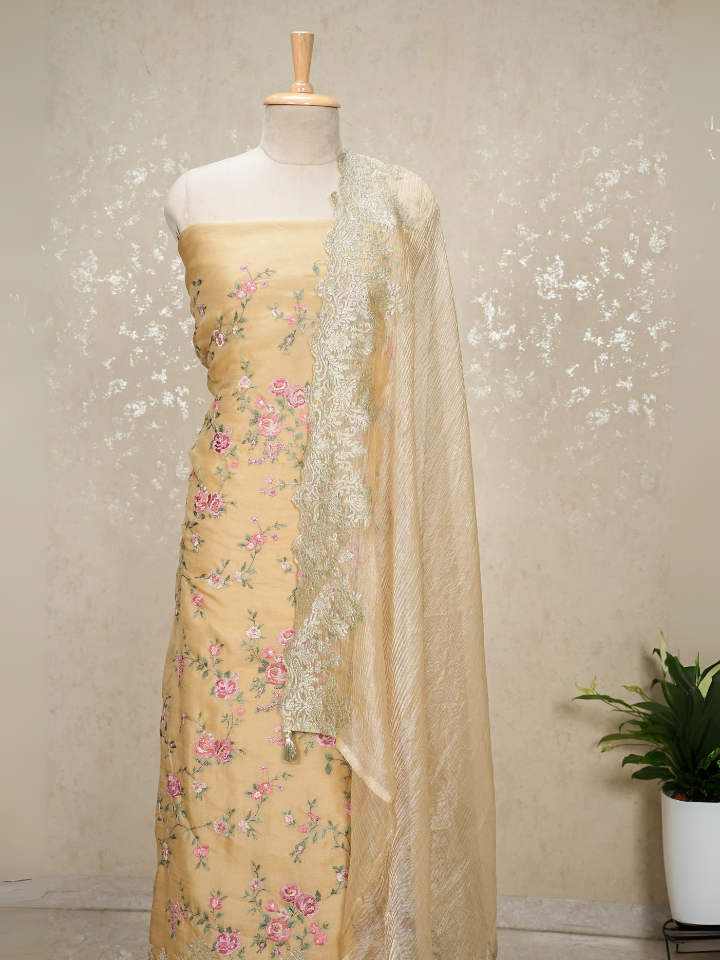 Beige organza shirt with heavy thread embroidery and zari embroidery on hem and dupatta border with crepe bottom